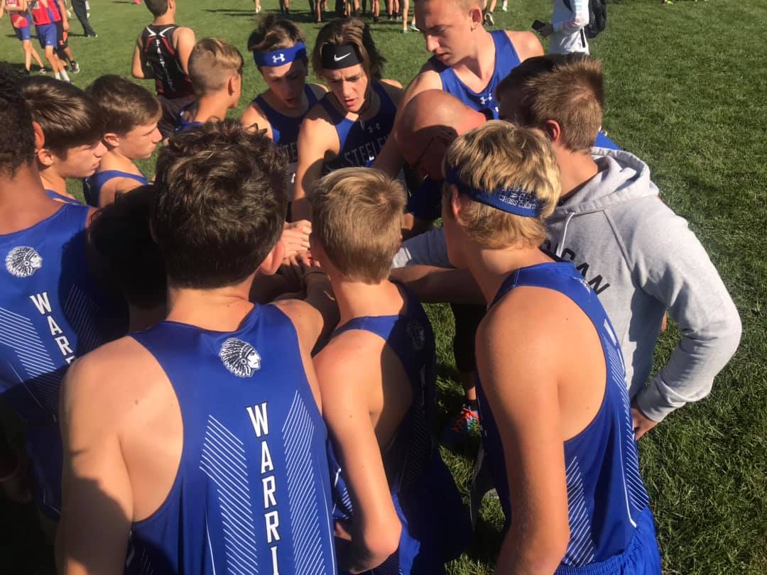 The boys cross country team at Peoria, on September 14, 2019, getting ready for the race.